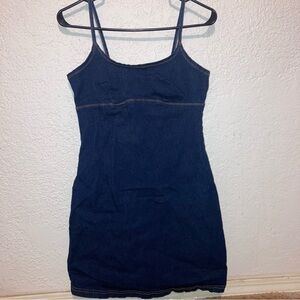 Y2k inspired vintage-style dark wash denim spaghetti strap mini dress.